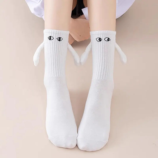 Hand socks with cartoon eyes and magnets