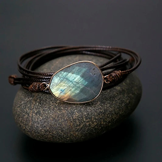 A bracelet made of natural stones on a rope basis