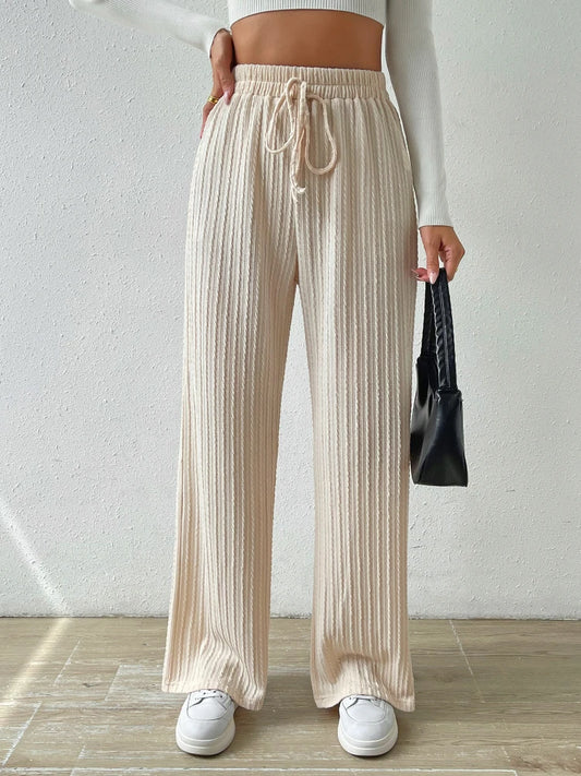 New knitted trousers with ties at the waist and wide legs