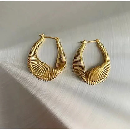 Dive into the world of unique fashion with our Twist Earrings