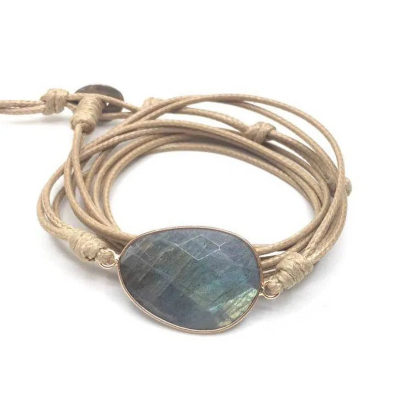 A bracelet made of natural stones on a rope basis