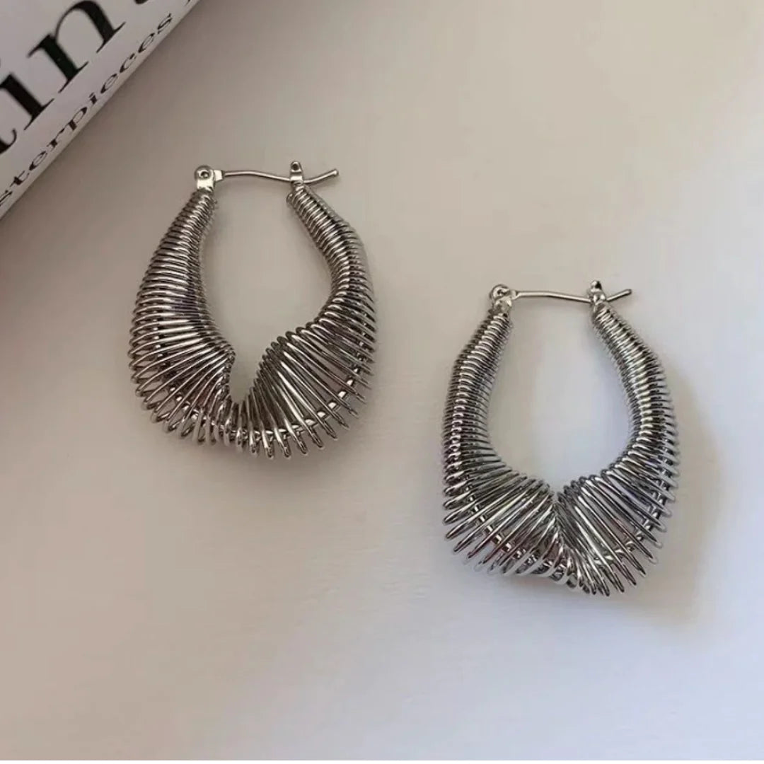 Dive into the world of unique fashion with our Twist Earrings