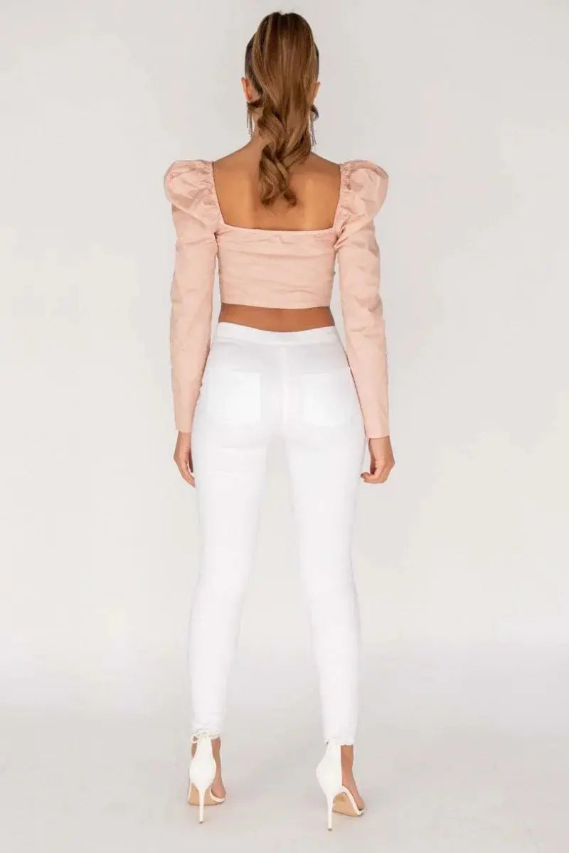 WHITE JEGGINGS WITH KNEE-LENGTH SLIT AND HIGH WAIST