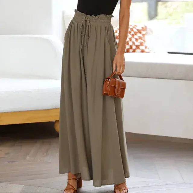 Women's trousers of solid color with elastic band with high waist, wide trousers