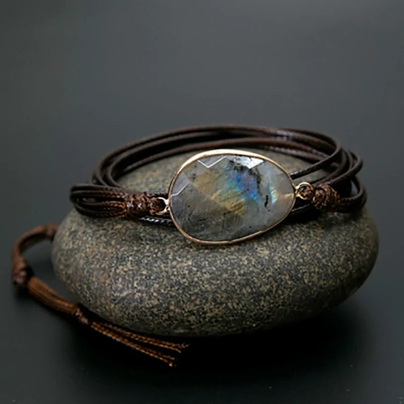 A bracelet made of natural stones on a rope basis