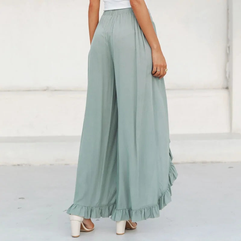 Vintage green trousers with a high waist and wide legs with green frills