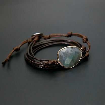 A bracelet made of natural stones on a rope basis